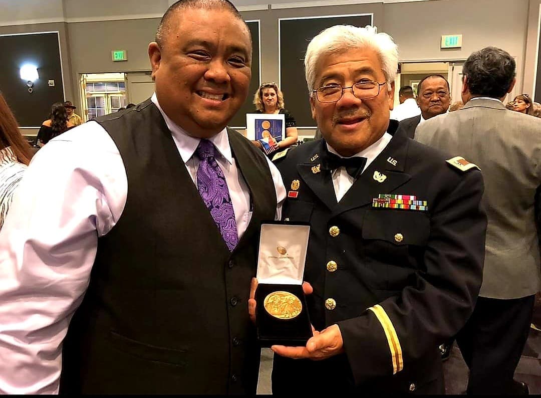 Rolo Viray receiving an award